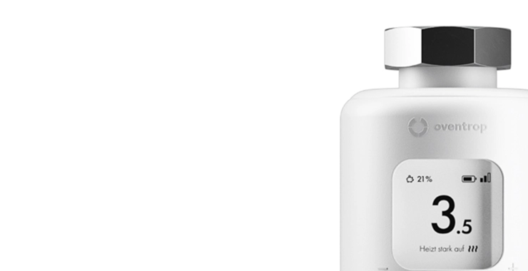 Close-up of an Oventrop thermostat set to 3.5 with the display “Heating up strongly.”